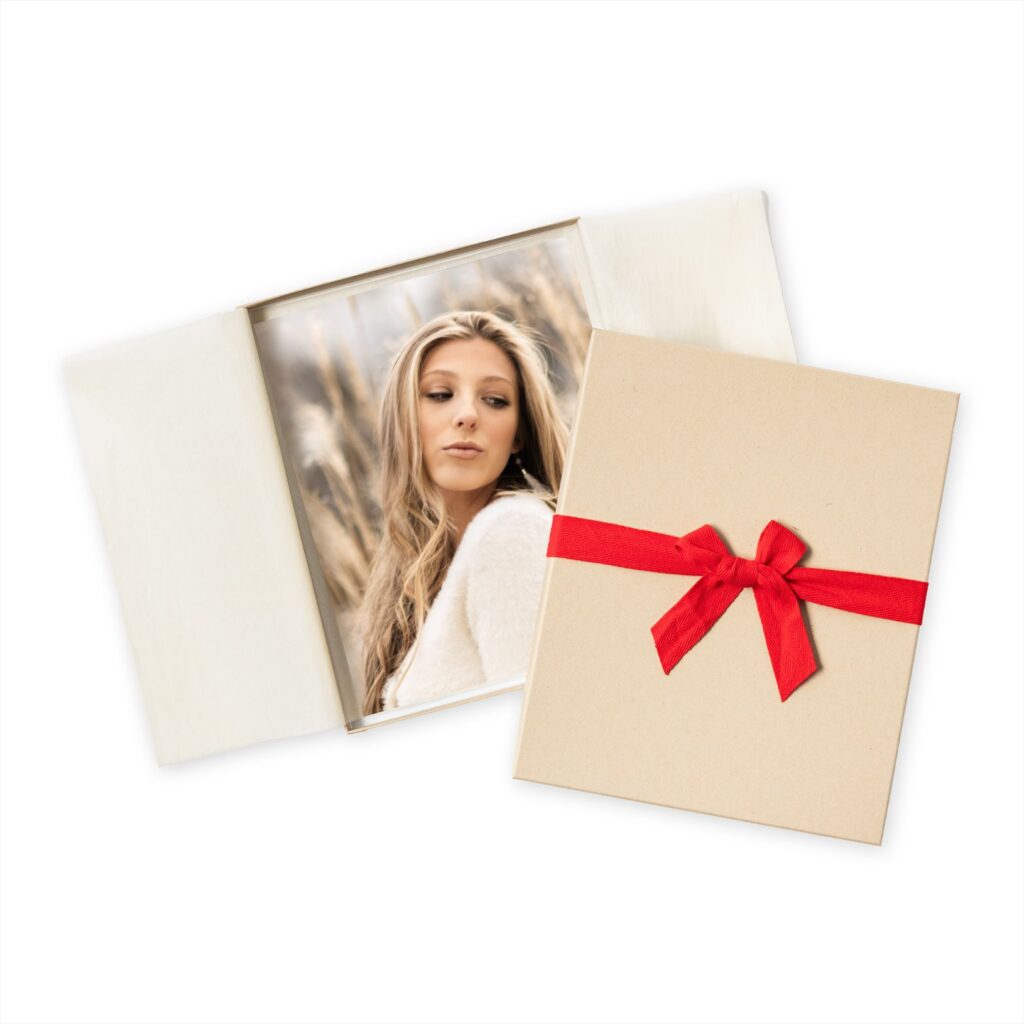 photo print of senior girl with premium gift wrapping and box with bow.